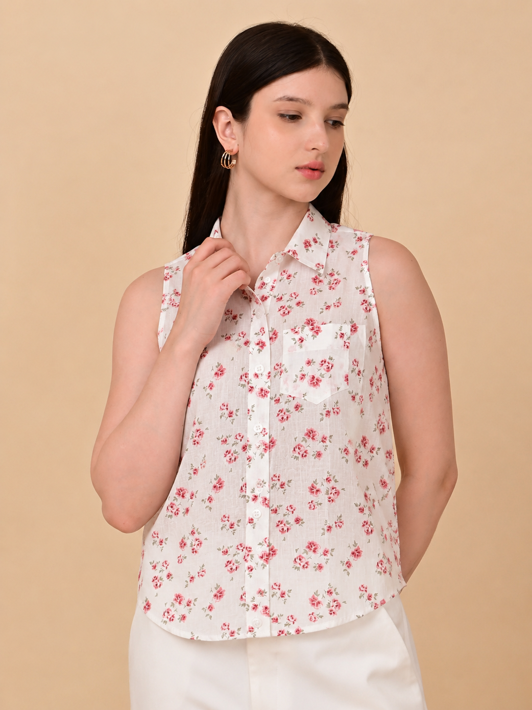 White floral sleeveless shirt for women with pink rose print and classic collar